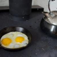 "Tea and cast iron fried eggs over a wood burning stove" Wellington, Prince Edward County, Ontario